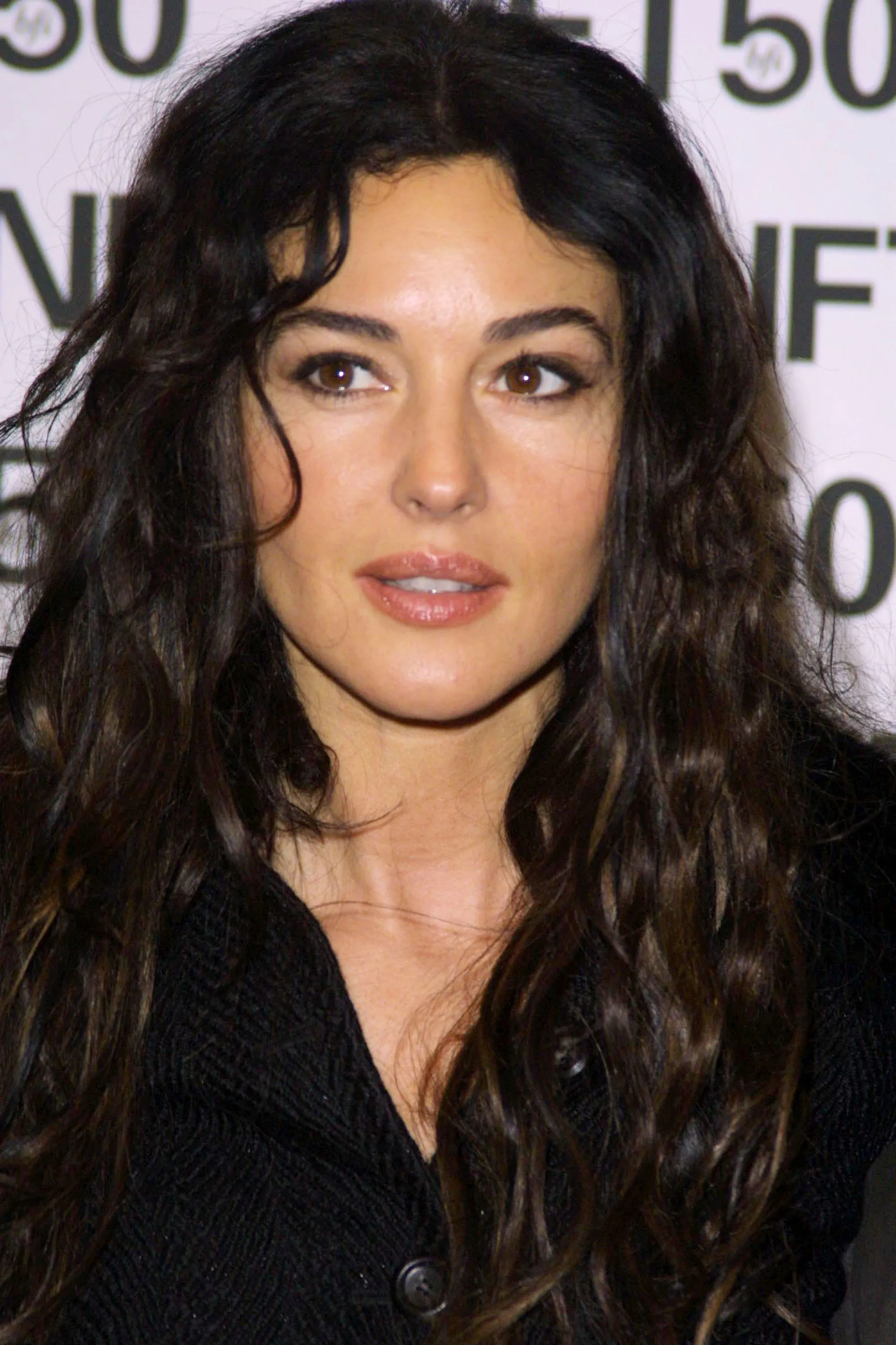 For a screening in London, Bellucci wore her hair in a cascade of wonderfully unruly curls.