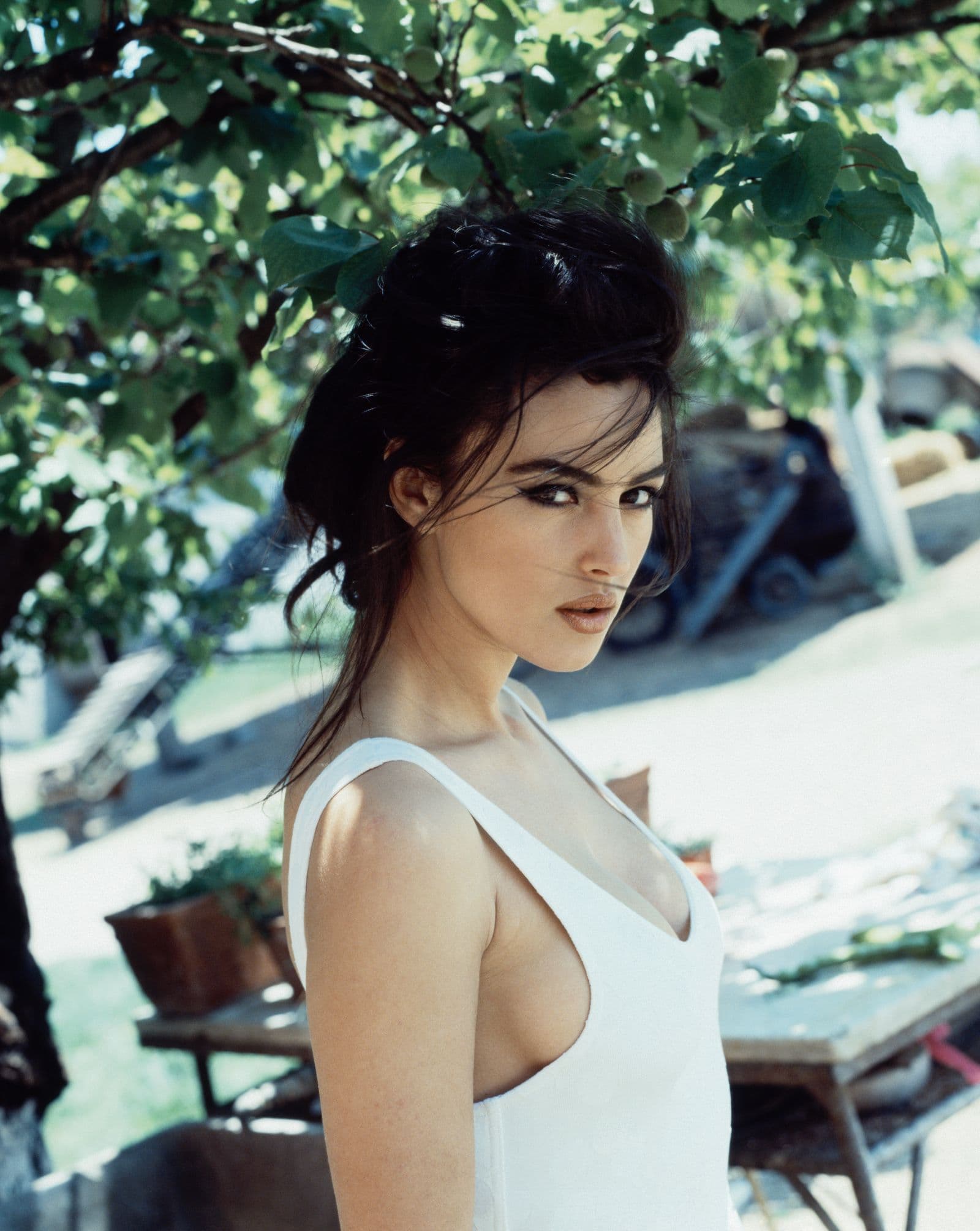 Monica Bellucci photographed at home in Rome in June 1991, wearing her dark hair in softly brushed natural waves.