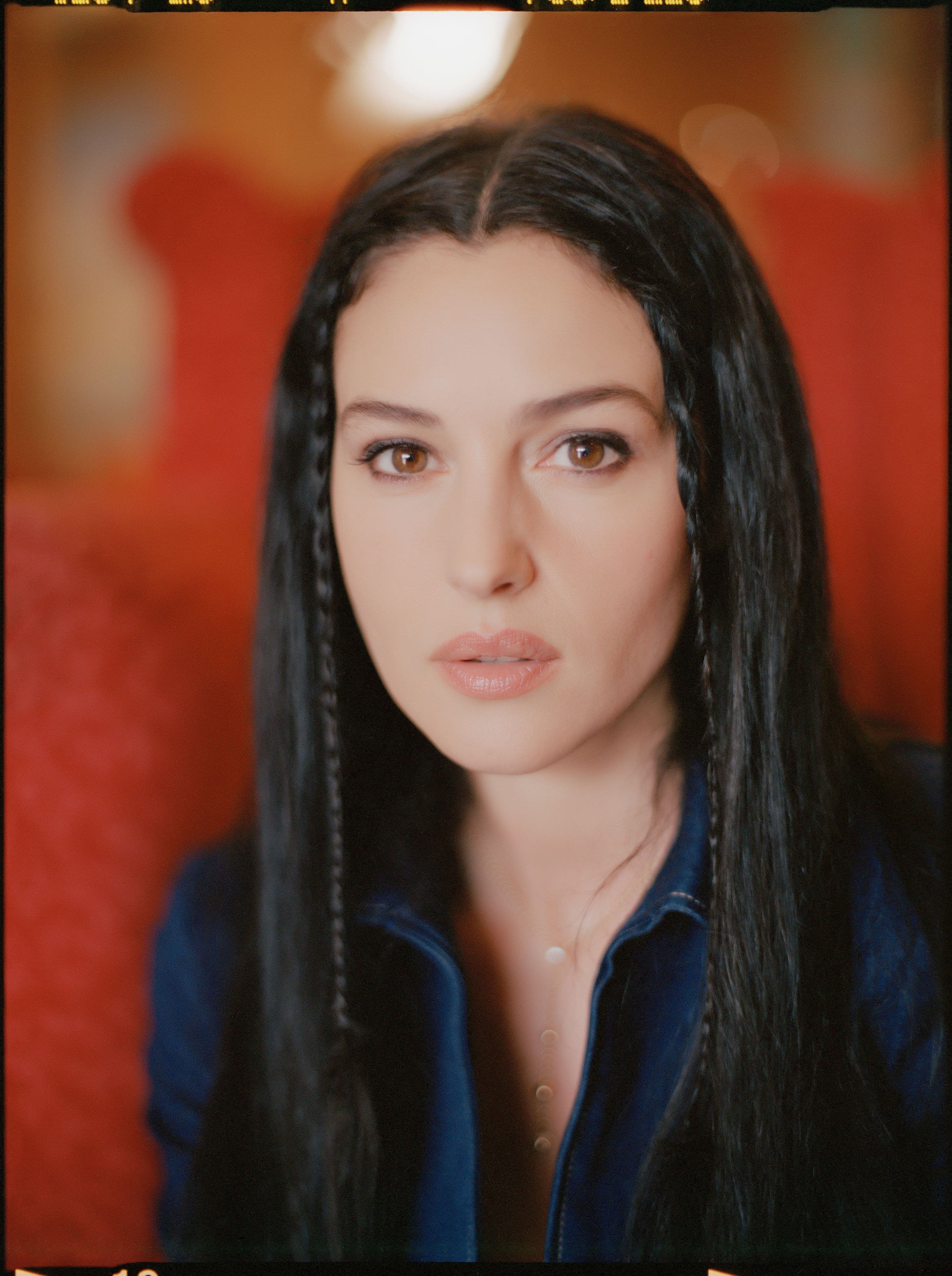 Monica Bellucci at the Carlton Hotel during the 1997 Cannes Film Festival, with luminous skin and polished dark hair.