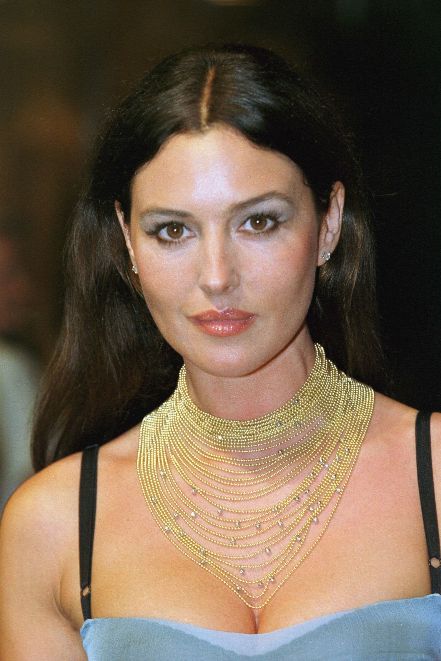 At a ball in Monaco, Bellucci pairs a baby-blue dress with gold strands dotted with diamonds and matching earrings.