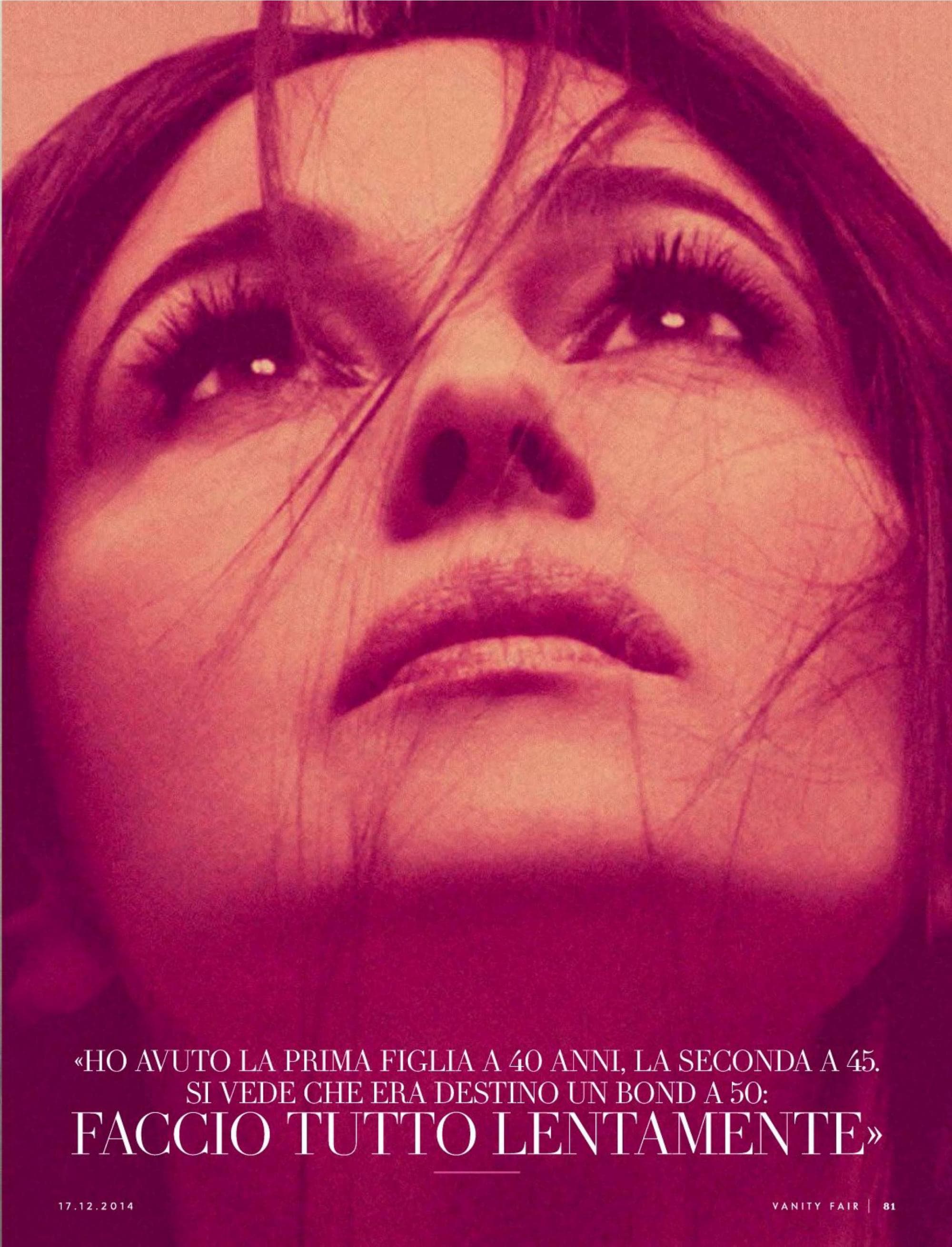 A vivid red-toned close-up captures Bellucci's cinematic presence in the Vanity Fair Italia editorial.
