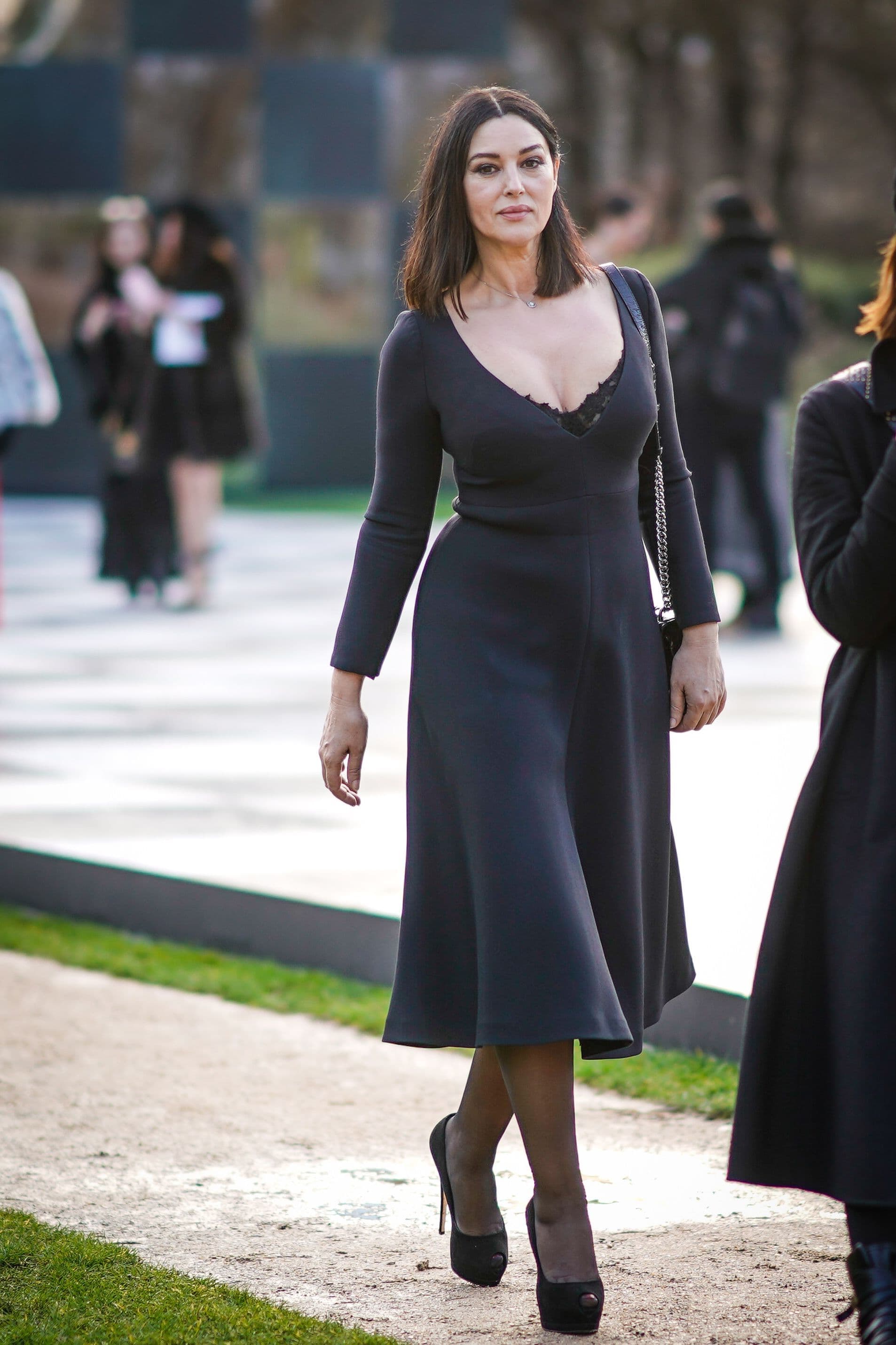 Leaving the Dior Couture show in Paris, Bellucci wears a sophisticated beauty look with softly tousled hair.