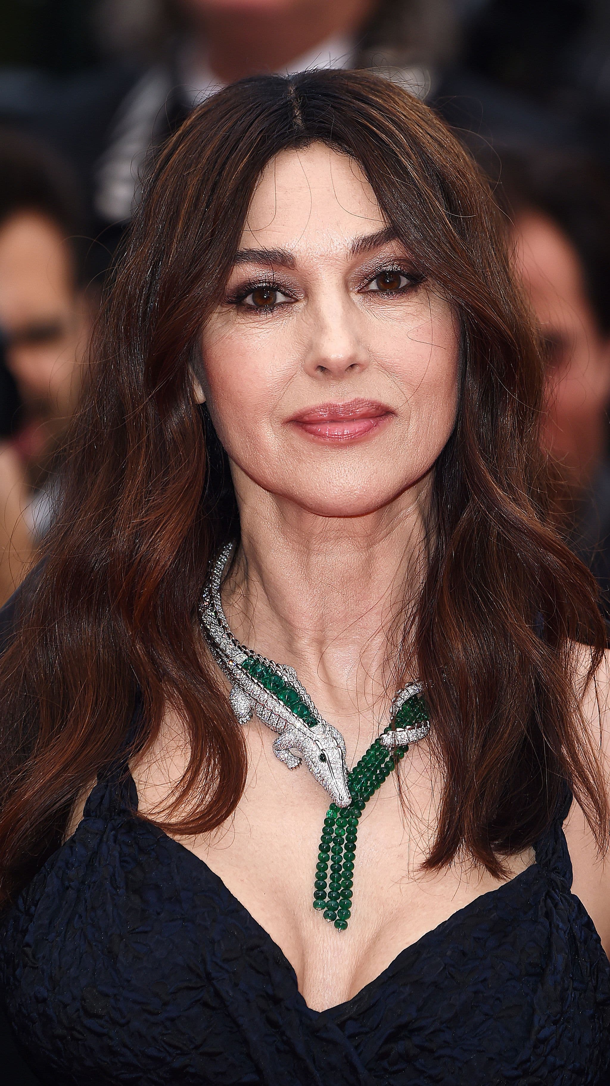 At Cannes in 2019, Bellucci revisits Cartier's María Félix crocodile suite in emeralds and diamonds.