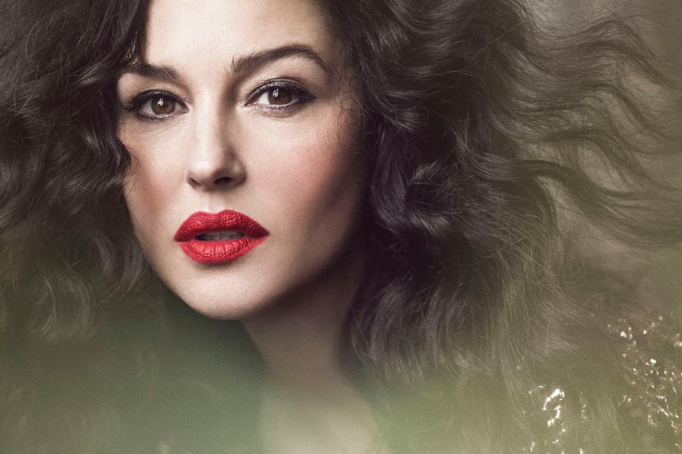 With her signature bold red lips, and wavy hair, Monica sizzles in black with just a dash of floral prints and shades.