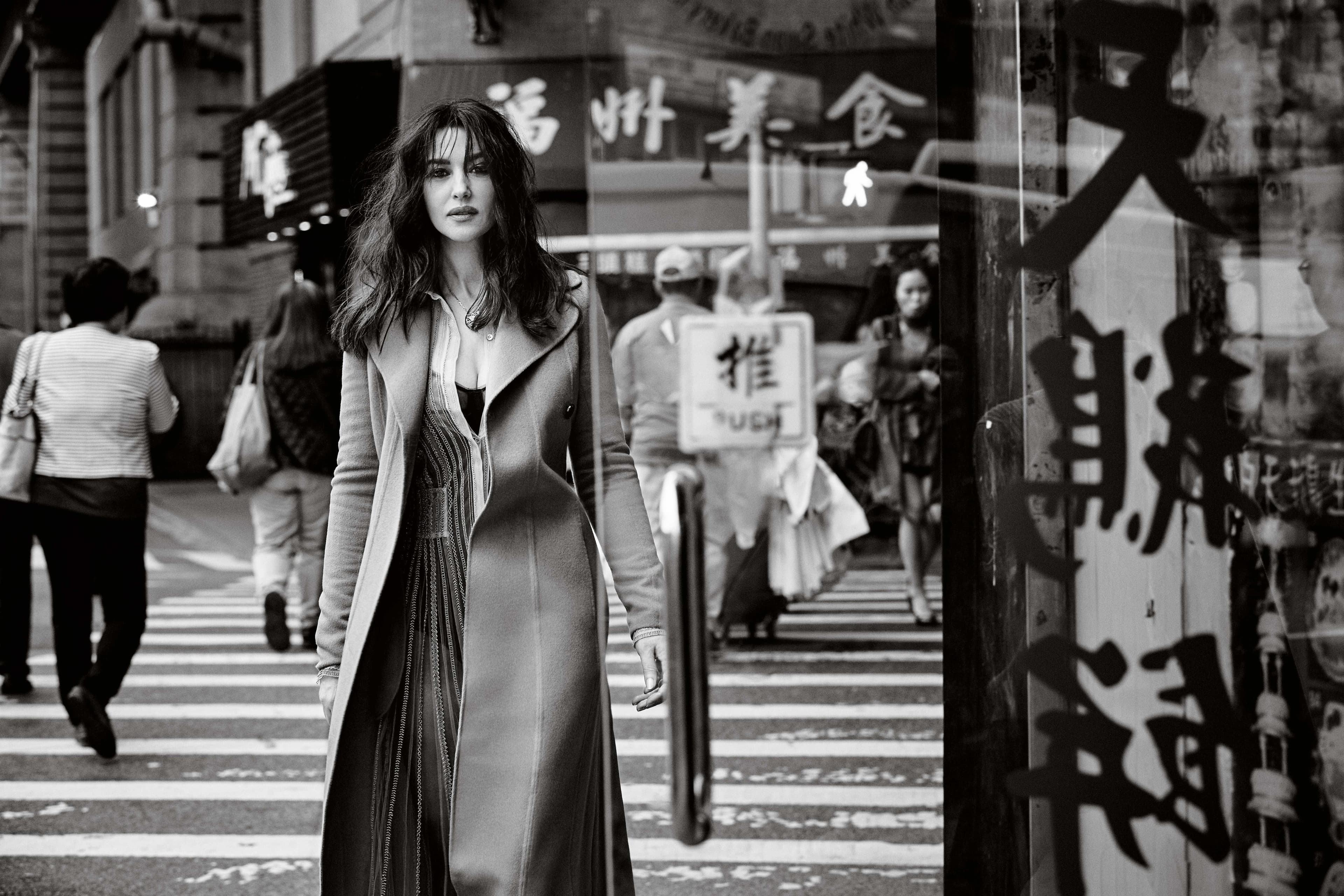 At 52, Bellucci has a compelling voice, is even more beautiful in the flesh than on film, and appears, rather stylishly, to be wearing an off-the-shoulder evening top at 10.30 in the morning. The fake eyelashes, it transpires, are not for my benefit. She was shooting a film yesterday to promote a song she’s made with a leading French singer. She explains she gets approached for work all the time, especially by photographers, and normally says no. But when Francesco Carrozzini called her for this Telegraph shoot it was different. ‘I knew his mother,’ Bellucci says, referring to the Italian Vogue editor Franca Sozzani, who died last year. They met in Bellucci’s previous life as a model. ‘She was one of the greatest women I ever met,’ Bellucci continues. ‘Such a strong woman. I had so much respect for her, the way she managed her professional life, her personal life. So when he called me, I said yes. It was a way to be in touch with her. That day we did the shoot in Chinatown in New York, I thought about her a lot.’ Success as a model came before success as an actress, and Bellucci still feels very much at home being photographed. The struggle, she admits, was being taken seriously in films at the start of her career, when in 1990 she was cast in the Italian-language film Vita coi figli (Life with the Kids) by the Italian director Dino Risi after he saw her picture in a magazine. ‘The most difficult period was when I transferred from modelling to acting,’ she has said. Perhaps this is why she has pursued ‘difficult’ roles such as that of a rape victim in the controversial thriller Irreversible, Mary Magdalene in Mel Gibson’s The Passion of the Christ, and the Mirror Queen in Terry Gilliam’s The Brothers Grimm. ‘When you are beautiful and you do something that is very strong, people say you are courageous, but they don’t say you are good,’ she says. ‘Now I am older, they say, “You are good.”’ Bellucci is upbeat about ageing. But then she hasn’t really aged. She hasn’t lost her looks (she credits acupuncture and facial massages) or her figure – ‘I do Pilates and swim, but I don’t wake up at six and go to the gym. Forget it!’ – and has a ready list of inspirational maxims: ‘It is not a matter of age, it is a matter of energy,’ ‘The body gets older but the soul younger,’ ‘You can be old at just 20,’ and so forth.